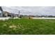 Lush backyard with a pond view and a cozy swing offers an ideal setting at 3164 Kent Dr, Brownsburg, IN 46112