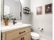 Chic powder room with wood vanity, modern fixtures, and decorative wall art at 3164 Kent Dr, Brownsburg, IN 46112