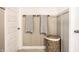 Bathroom featuring wainscoting, towel racks, and a stylish woven hamper, provides ample storage at 3164 Kent Dr, Brownsburg, IN 46112