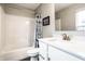 Bright bathroom features a shower-tub combination and a white vanity with a stone countertop at 3164 Kent Dr, Brownsburg, IN 46112