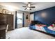 bedroom featuring blue accent wall, carpet flooring, ample natural light and modern furniture at 3164 Kent Dr, Brownsburg, IN 46112