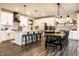 Bright kitchen features white cabinets, gray subway tile backsplash, a large island, and an adjacent dining area at 3164 Kent Dr, Brownsburg, IN 46112