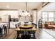 Spacious kitchen and dining area with white cabinets, stainless steel appliances, and an open concept design at 3164 Kent Dr, Brownsburg, IN 46112