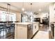 Open concept kitchen featuring a large island, stainless steel appliances, and sleek finishes at 3164 Kent Dr, Brownsburg, IN 46112