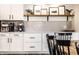 Close-up of a modern kitchen featuring stylish decor, white cabinets, and stainless steel appliances at 3164 Kent Dr, Brownsburg, IN 46112