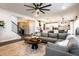 Spacious living room with open concept to kitchen featuring large sectional at 3164 Kent Dr, Brownsburg, IN 46112