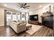 Cozy living room with a fireplace, a large sectional sofa, and lots of natural light at 3164 Kent Dr, Brownsburg, IN 46112