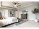 Bright main bedroom with neutral decor, tray ceilings, and carpet flooring at 3164 Kent Dr, Brownsburg, IN 46112