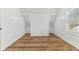 Bedroom featuring hardwood floors, trim, windows, and built in closets at 324 W 7Th St, Anderson, IN 46016
