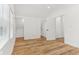 Bedroom featuring hardwood floors, trim, window, and large closet at 324 W 7Th St, Anderson, IN 46016