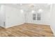 Bright bedroom featuring light wood floors, tray ceiling, and abundant natural light from large windows at 324 W 7Th St, Anderson, IN 46016