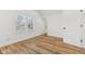 Bedroom featuring hardwood floors, windows, and large closet at 324 W 7Th St, Anderson, IN 46016