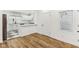 Bright kitchen with white cabinetry, stainless steel appliances, and hardwood flooring at 324 W 7Th St, Anderson, IN 46016
