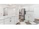 Well-lit kitchen featuring white cabinets, marble countertops, and stainless steel appliances at 324 W 7Th St, Anderson, IN 46016