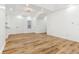 Bright, open-concept living area with wood floors, offering a seamless transition to other living spaces at 324 W 7Th St, Anderson, IN 46016