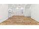 Bright, open-concept living area with wood floors, offering a seamless transition to other living spaces at 324 W 7Th St, Anderson, IN 46016