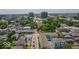This aerial view showcases the neighborhood's charming streetscapes and the city skyline in the distance at 325 E 10Th St, Indianapolis, IN 46202