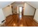 Finished attic with sloped ceilings, hardwood floors, and multiple rooms at 325 E 10Th St, Indianapolis, IN 46202