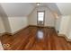 Finished attic with sloped ceilings, hardwood floors, and natural light at 325 E 10Th St, Indianapolis, IN 46202