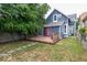 A charming backyard with a deck, fenced yard, and established trees at 325 E 10Th St, Indianapolis, IN 46202