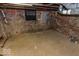 Unfinished basement featuring concrete floor and brick walls at 325 E 10Th St, Indianapolis, IN 46202