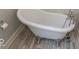 Close up of claw foot bathtub with chrome fixtures and marble floors at 325 E 10Th St, Indianapolis, IN 46202