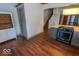 View of the kitchen, stairs and a glimpse into an adjacent room at 325 E 10Th St, Indianapolis, IN 46202
