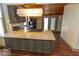 Granite kitchen island with cooktop and stainless steel appliances at 325 E 10Th St, Indianapolis, IN 46202