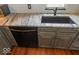 Modern kitchen sink and fixtures with granite countertops at 325 E 10Th St, Indianapolis, IN 46202