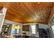Bright kitchen with wooden ceiling, modern appliances, and eat-in counter at 325 E 10Th St, Indianapolis, IN 46202
