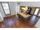 Open-concept kitchen features a large island, stainless appliances, and hardwood floors at 325 E 10Th St, Indianapolis, IN 46202