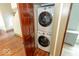 Laundry closet features stacked washer and dryer, located on the first floor at 325 E 10Th St, Indianapolis, IN 46202