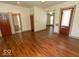 Large living room features gleaming wood floors, neutral paint, and open flow into other spaces at 325 E 10Th St, Indianapolis, IN 46202