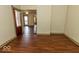 Open-concept living space featuring beautiful wood floors and seamless transitions into other areas of the home at 325 E 10Th St, Indianapolis, IN 46202