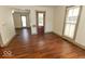 Light-filled living area showcases beautiful wood floors and neutral wall tones, ideal for customization at 325 E 10Th St, Indianapolis, IN 46202