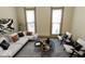 Modern living room is styled with a plush sectional sofa, stylish decor, and soft, neutral colors at 325 E 10Th St, Indianapolis, IN 46202