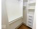 Organized walk-in closet with built-in shelves and drawers, ideal for storage at 325 E 10Th St, Indianapolis, IN 46202