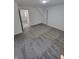 Carpeted bedroom features bright white walls, and large doorway leading to a hallway at 3614 N Capitol Ave, Indianapolis, IN 46208
