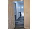 Hallway shot into another room, with gray and white stairs visible; very well lit with pot lights at 3614 N Capitol Ave, Indianapolis, IN 46208