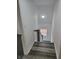 Clean staircase featuring gray treads and white risers leading to carpeted upper level at 3614 N Capitol Ave, Indianapolis, IN 46208