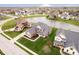 Aerial view showcasing the home's placement near a serene pond and manicured landscaping at 3989 Birkdale Dr, Carmel, IN 46033