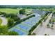 Aerial view showcasing tennis courts, pool, and country club amenities at 3989 Birkdale Dr, Carmel, IN 46033