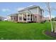 Expansive backyard with a covered patio, perfect for outdoor entertaining and relaxation at 3989 Birkdale Dr, Carmel, IN 46033