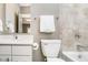 Clean bathroom with tiled walls, white fixtures, and walk-in shower at 3989 Birkdale Dr, Carmel, IN 46033