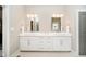 Elegant bathroom showcasing a double vanity with modern fixtures, ample counter space, and stylish mirrors at 3989 Birkdale Dr, Carmel, IN 46033