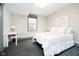 Bedroom with natural light, a bed, a work desk, and neutral-toned walls at 3989 Birkdale Dr, Carmel, IN 46033