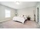 Neutral bedroom with large window, carpet flooring, and ample natural light at 3989 Birkdale Dr, Carmel, IN 46033