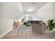 Bright bonus room featuring vaulted ceilings, neutral decor, and modern furnishings for a cozy, inviting atmosphere at 3989 Birkdale Dr, Carmel, IN 46033