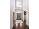Elegant foyer with high ceilings, hardwood floors, and stylish lighting fixture at 3989 Birkdale Dr, Carmel, IN 46033