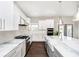 Modern kitchen with marble countertops, stainless steel appliances, and ample cabinet space and natural light at 3989 Birkdale Dr, Carmel, IN 46033
